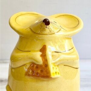 Yellow mouse holding a piece of cheese is perfect for holding Parmesan cheese.